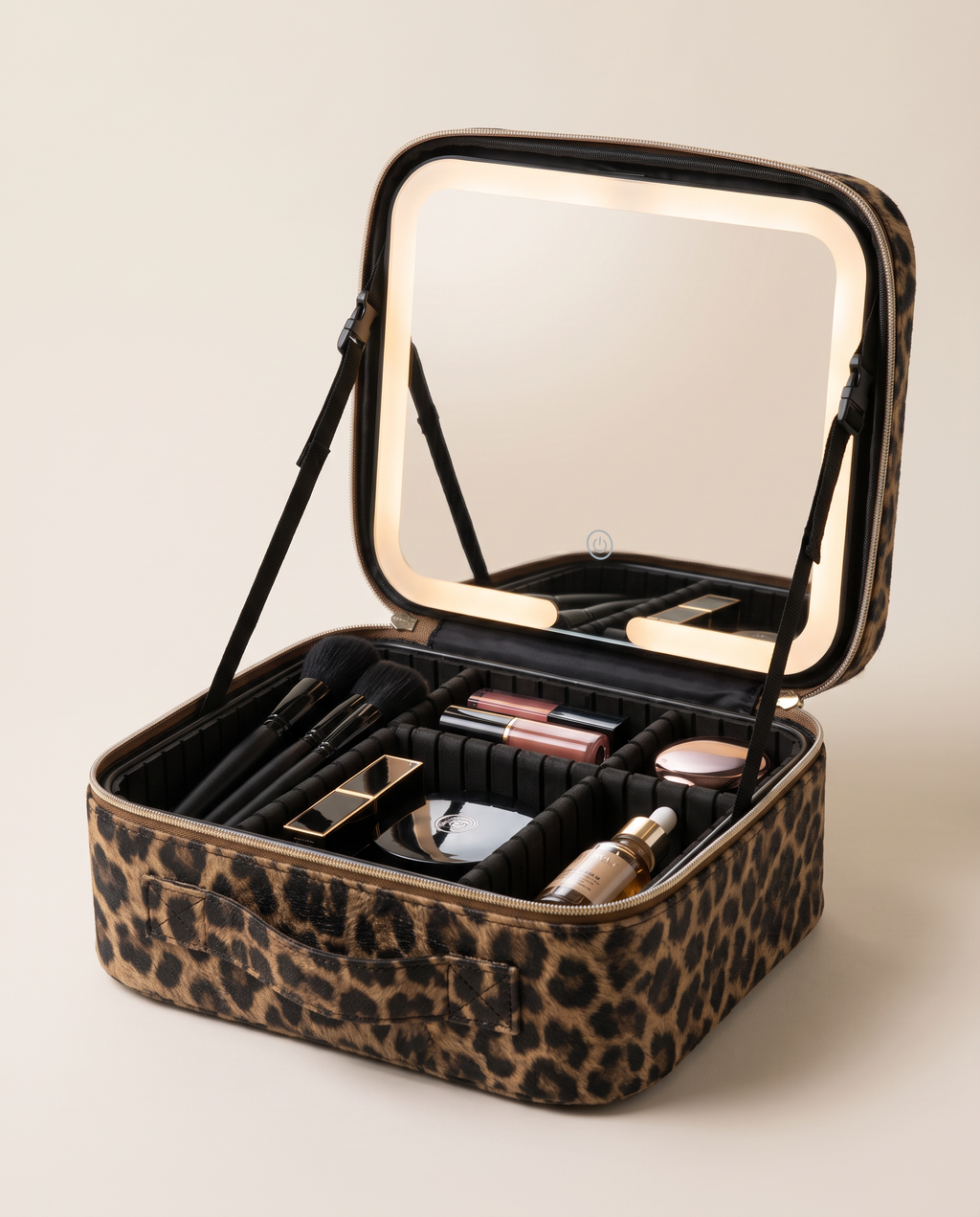 The case open with its LED mirror lit and makeup arranged inside